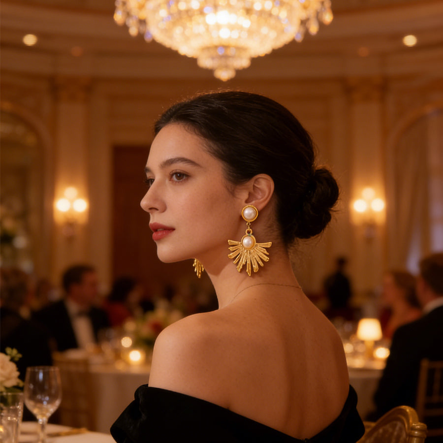 Boucles d’oreilles pendantes soleil — acier doré