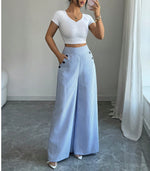 Pantalon large rayé, taille haute à boutons dorés