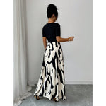 Robe longue bicolore, haut uni et jupe imprimée