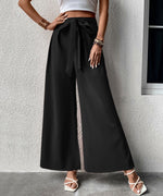 Pantalon large taille haute à ceinture nouée — tissu fluide — coloris