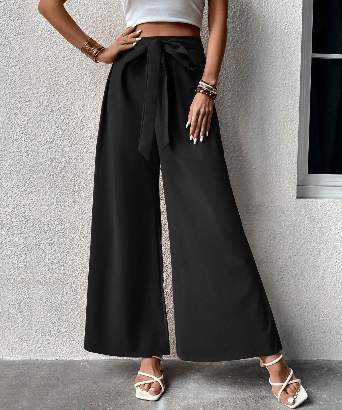 Pantalon large taille haute à ceinture nouée — tissu fluide — coloris