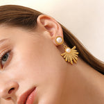 Boucles d’oreilles pendantes soleil — acier doré