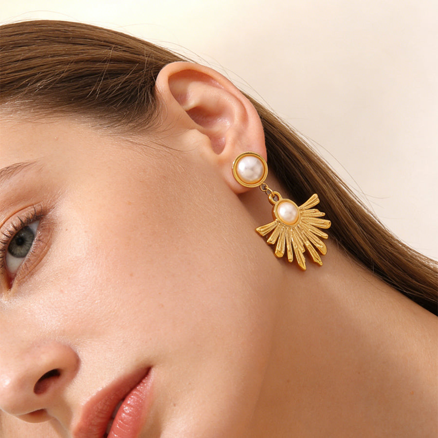 Boucles d’oreilles pendantes soleil — acier doré