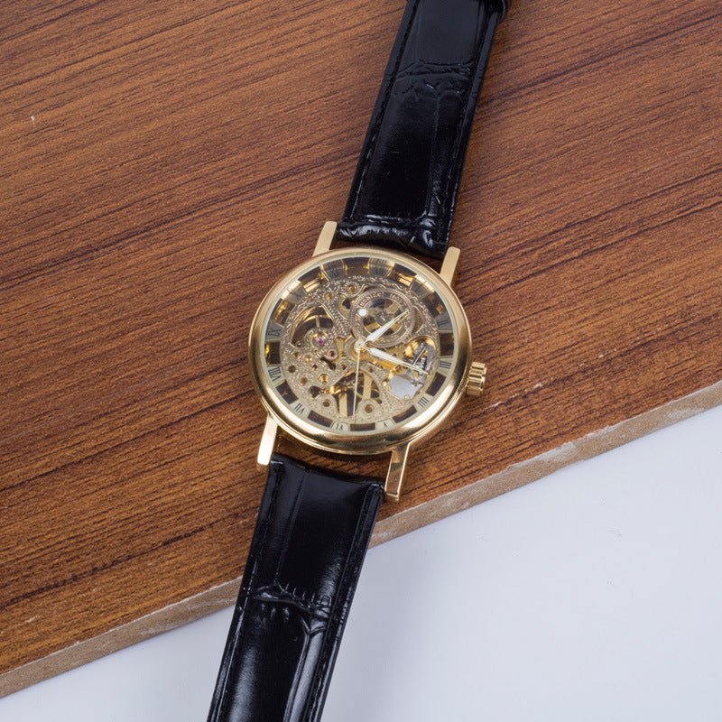 Montre mécanique squelette dorée à bracelet cuir noir