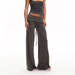 Pantalon large gris à taille repliée cloutée