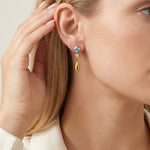 Boucles d’oreilles pendantes dorées — zircon bleu carré et goutte