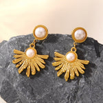 Boucles d’oreilles pendantes soleil — acier doré