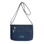 Sac femme à ligne structurée — anse courte et bandoulière — coloris