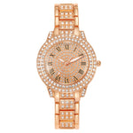 Montre femme pavée de strass, cadran étoilé et bracelet métal