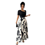 Robe longue bicolore, haut uni et jupe imprimée
