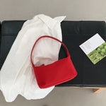 Sac baguette en nylon — poche zippée intérieure et porte-car — coloris