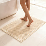 Tapis de bain gaufré à franges — polyester doux