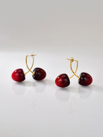 Puces d’oreilles cerise rouge en acier inoxydable