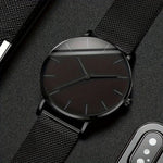 Montre homme noire ultra-fine, bracelet milanais