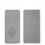 Tapis de silicone pliable qui fait béquille