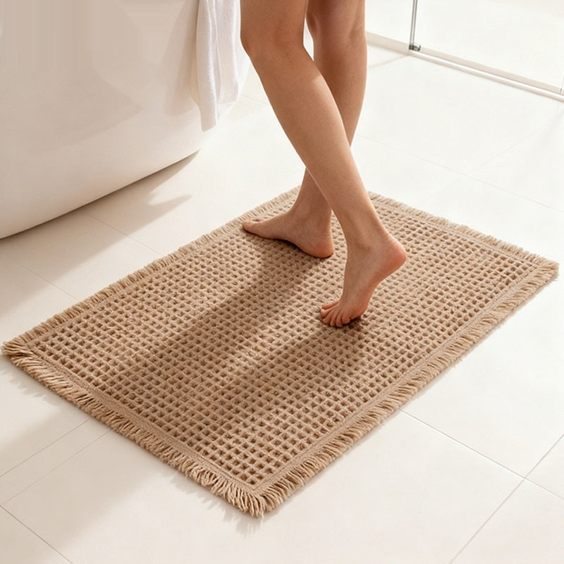 Tapis de bain gaufré à franges — polyester doux