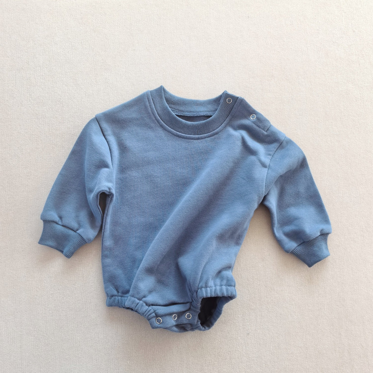 Combinaison bébé unie en coton — manches longues
