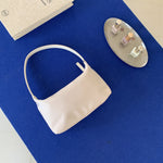 Sac baguette en nylon — poche zippée intérieure et porte-car — coloris