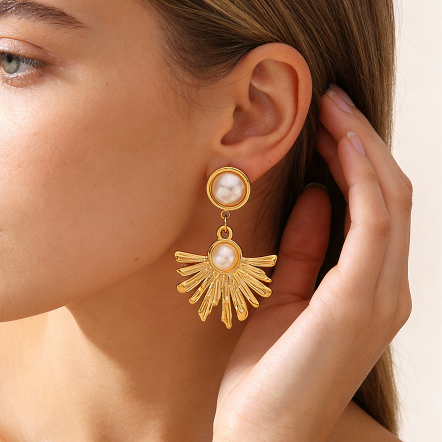 Boucles d’oreilles pendantes soleil — acier doré