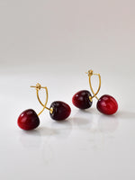 Puces d’oreilles cerise rouge en acier inoxydable