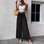Pantalon large taille haute à ceinture nouée — tissu fluide
