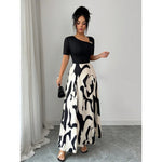 Robe longue bicolore, haut uni et jupe imprimée