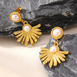 Boucles d’oreilles pendantes soleil — acier doré