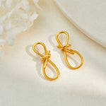 Boucles d'oreilles nœud en fil doré