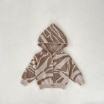 Gilet bébé à capuche en maille jacquard — motif zébré taupe et écru
