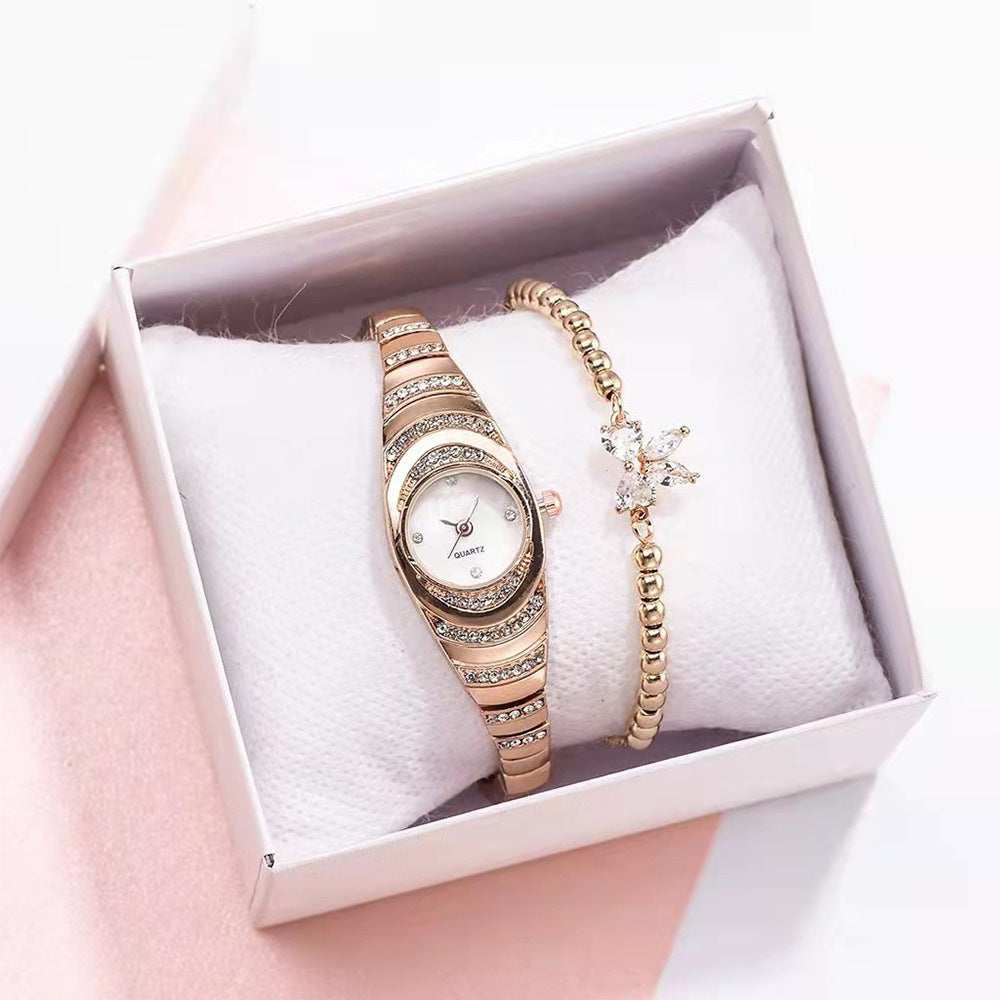 Montre femme fine sertie de strass, bracelet acier