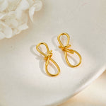 Boucles d'oreilles nœud en fil doré