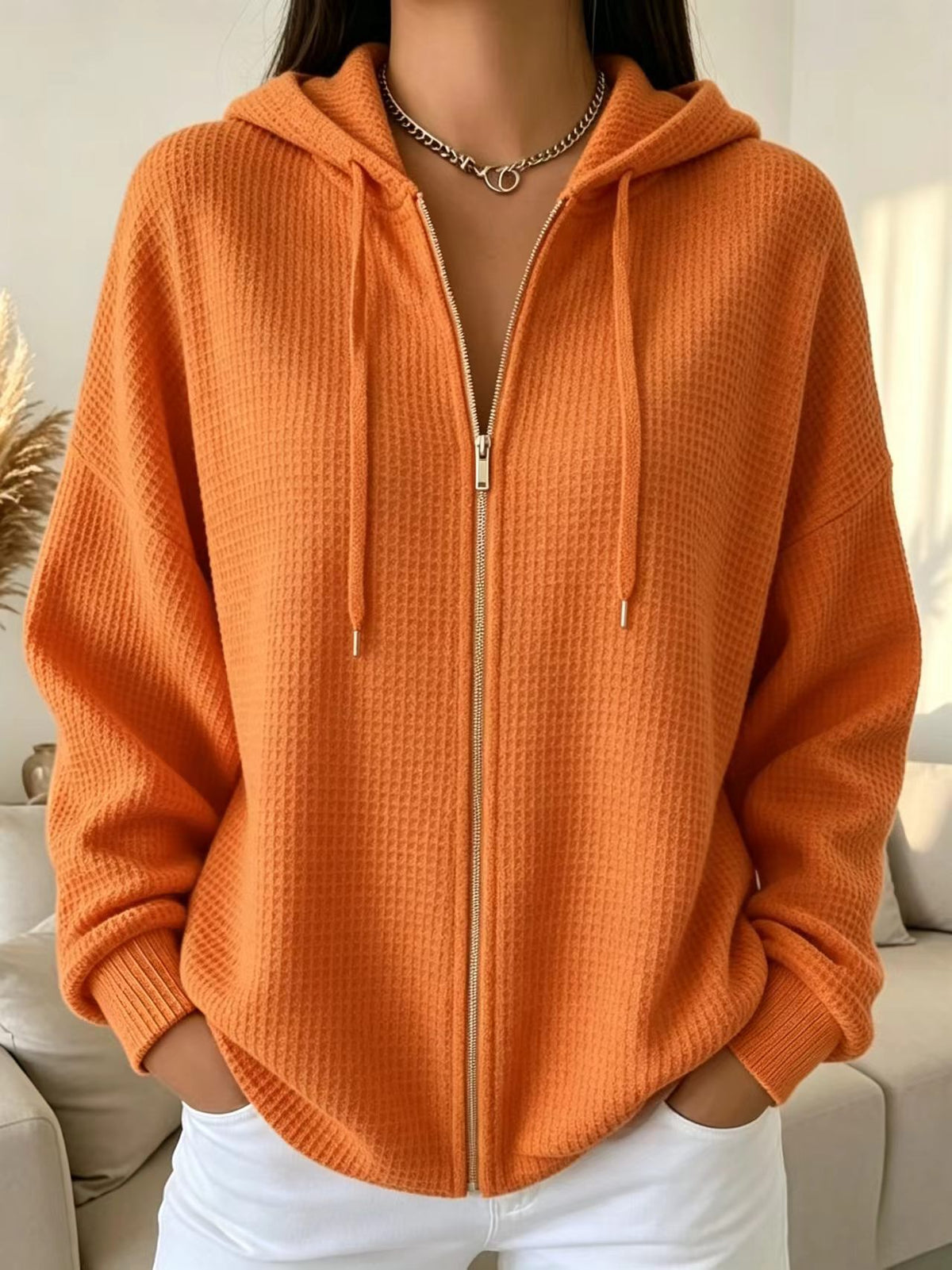 Gilet zippé à capuche en maille gaufrée