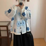 Gilet ample en maille bouclée à fleurs