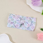 Bandeau bébé à nœud en nylon souple — 16 × 8 cm — coloris