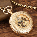 Montre de poche dorée à remontage manuel, décor gravé