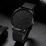 Montre homme noire ultra-fine, bracelet milanais