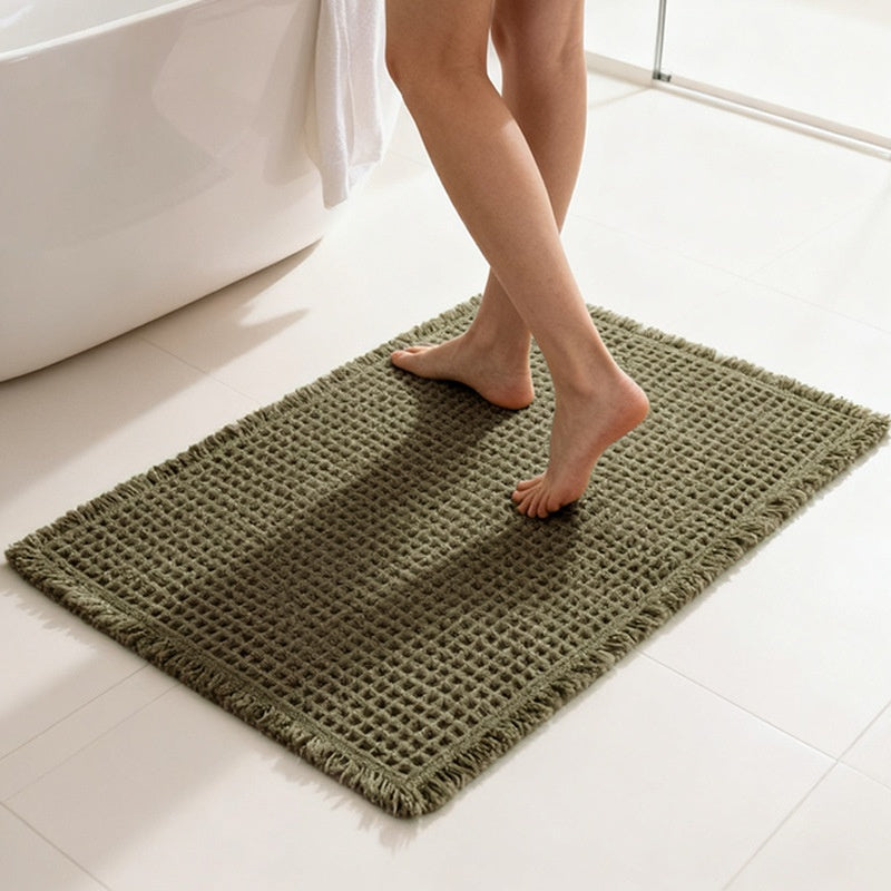 Tapis de bain gaufré à franges — polyester doux
