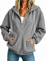 Sweat à capuche demi-zip — coupe ample, cordon de serrage