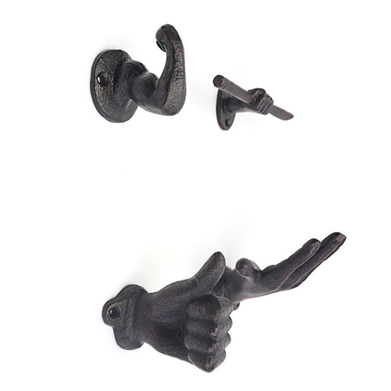 Patère en fonte, main ou bras en relief