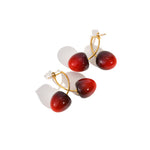Puces d’oreilles cerise rouge en acier inoxydable