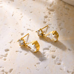 Boucles d’oreilles dorées à goutte de zircon — puce et pendant