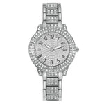 Montre femme pavée de strass, cadran étoilé et bracelet méta — coloris