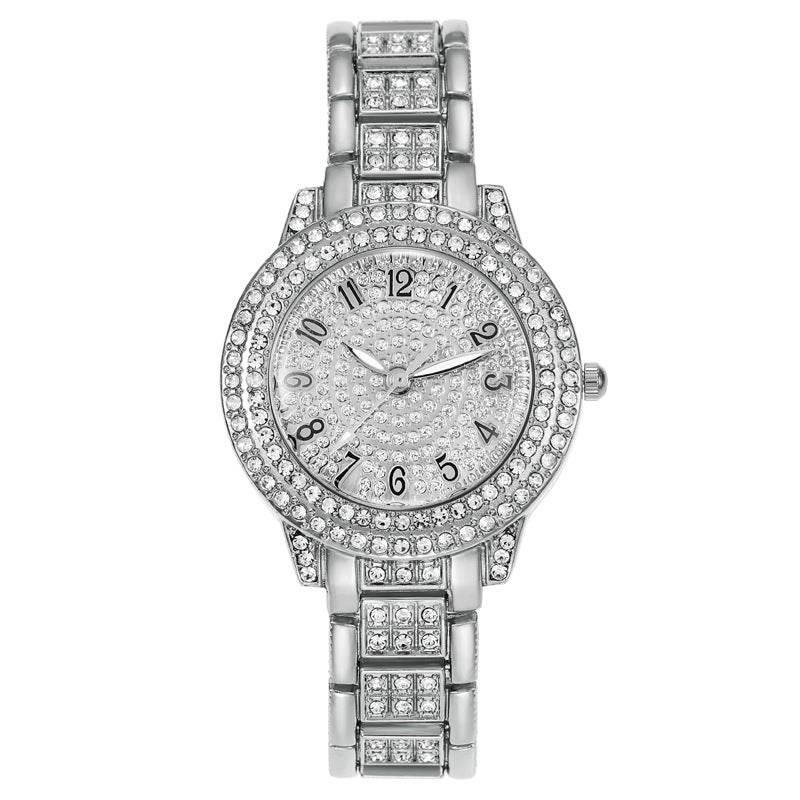 Montre femme pavée de strass, cadran étoilé et bracelet méta — coloris
