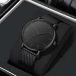 Montre homme noire ultra-fine, bracelet milanais