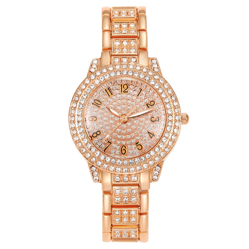 Montre femme pavée de strass, cadran étoilé et bracelet métal