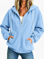 Sweat à capuche demi-zip — coupe ample, cordon de serrage