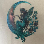 Décoration murale lune et libellule en métal patiné