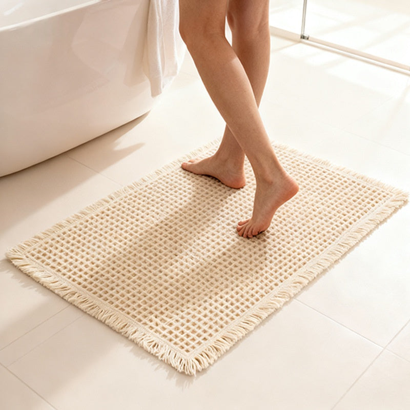 Tapis de bain gaufré à franges — polyester doux