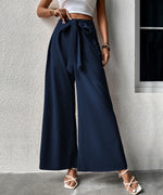 Pantalon large taille haute à ceinture nouée — tissu fluide