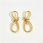Boucles d'oreilles nœud en fil doré